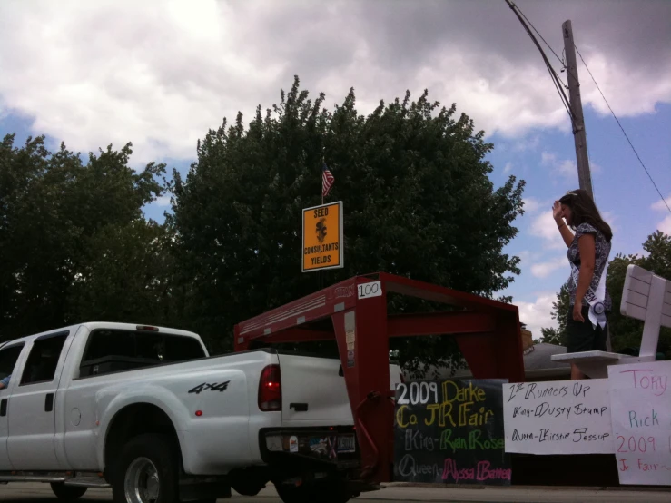 a truck with a truck bed on it and a trailer attached to the back