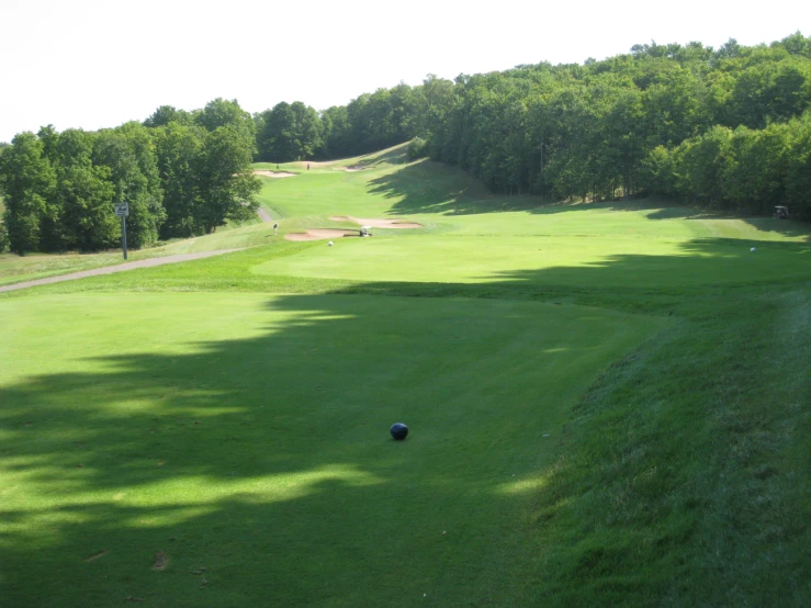 an open golf course with many green areas