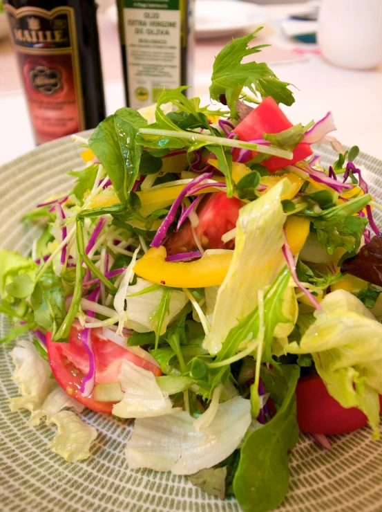 a plate with a salad with dressing