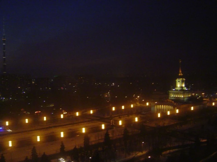 the night time city lights are glowing bright green