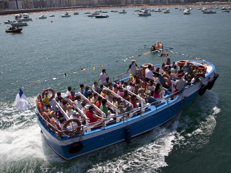 an aerial view of a large boat with many passengers