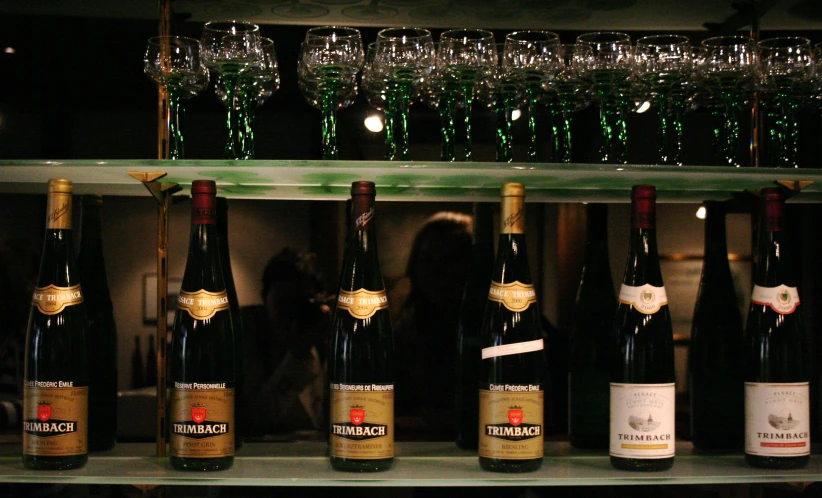 a number of bottles of wine on display in a room