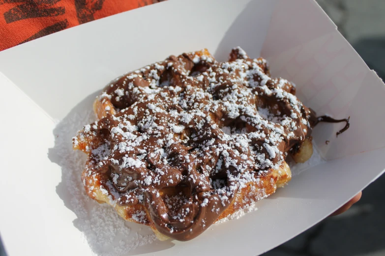a square waffle covered with powdered sugar