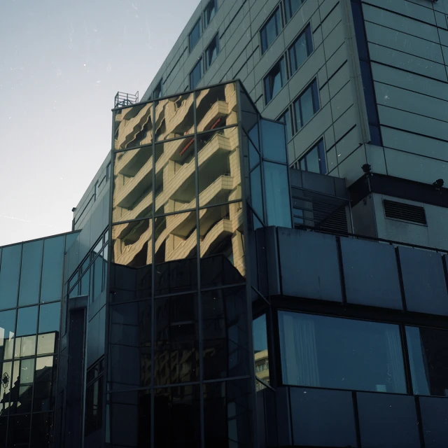 an abstract building with many windows against the sky