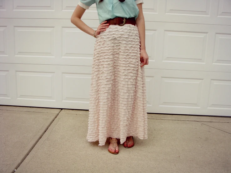 a woman standing in front of a garage door