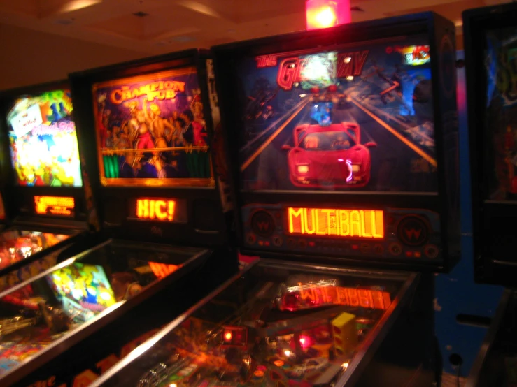 pinball games on display in an empty room