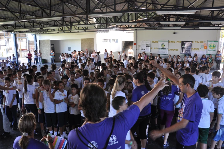 an image of a crowd of people being filmed