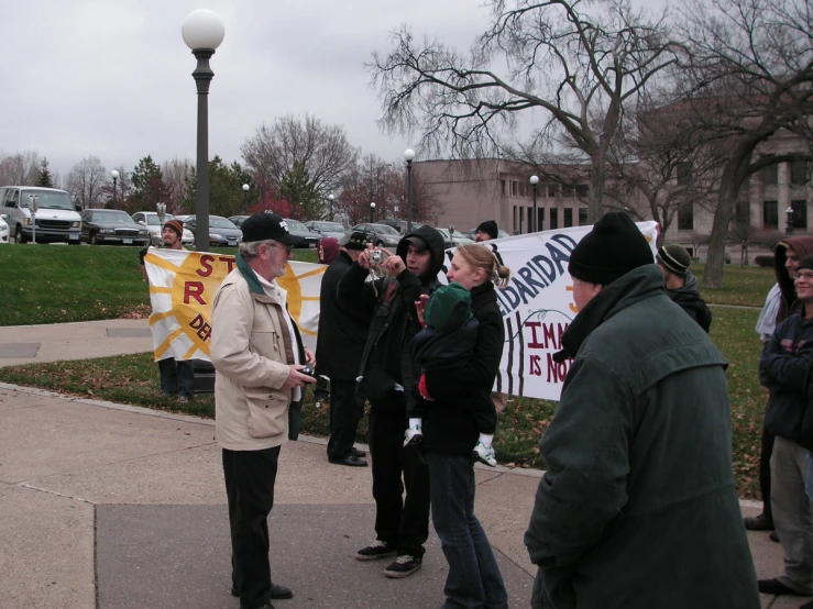 people with protest signs on a city street