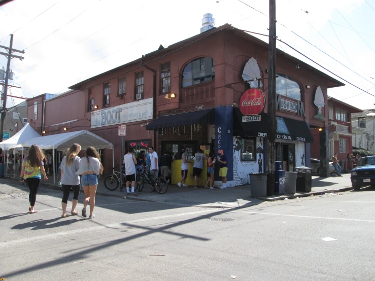 the front view of a small business on the side of a city street