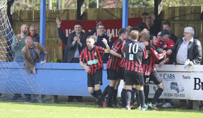 two boys are being congratulated at the match