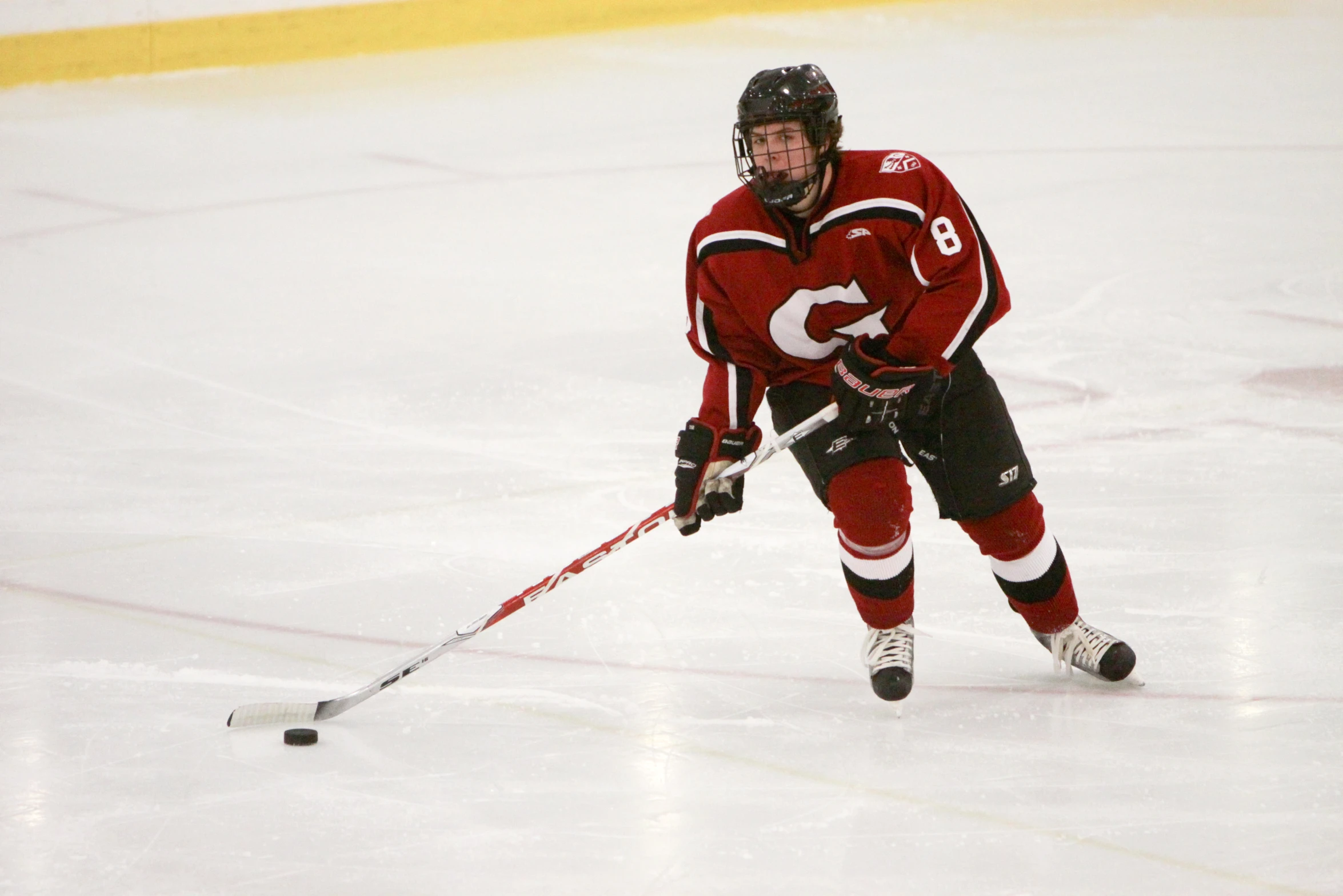 a man in uniform skating on the ice