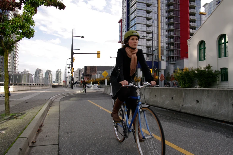 there is a woman on the bike talking on her phone