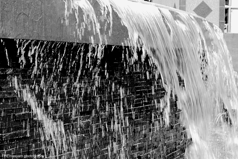 a black and white po of a waterfall