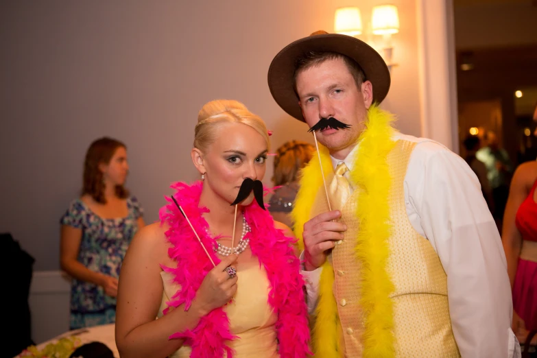 a man and woman in fancy costumes at a party