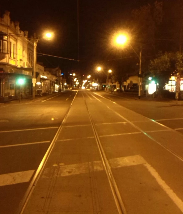 a city street at night with a lot of traffic