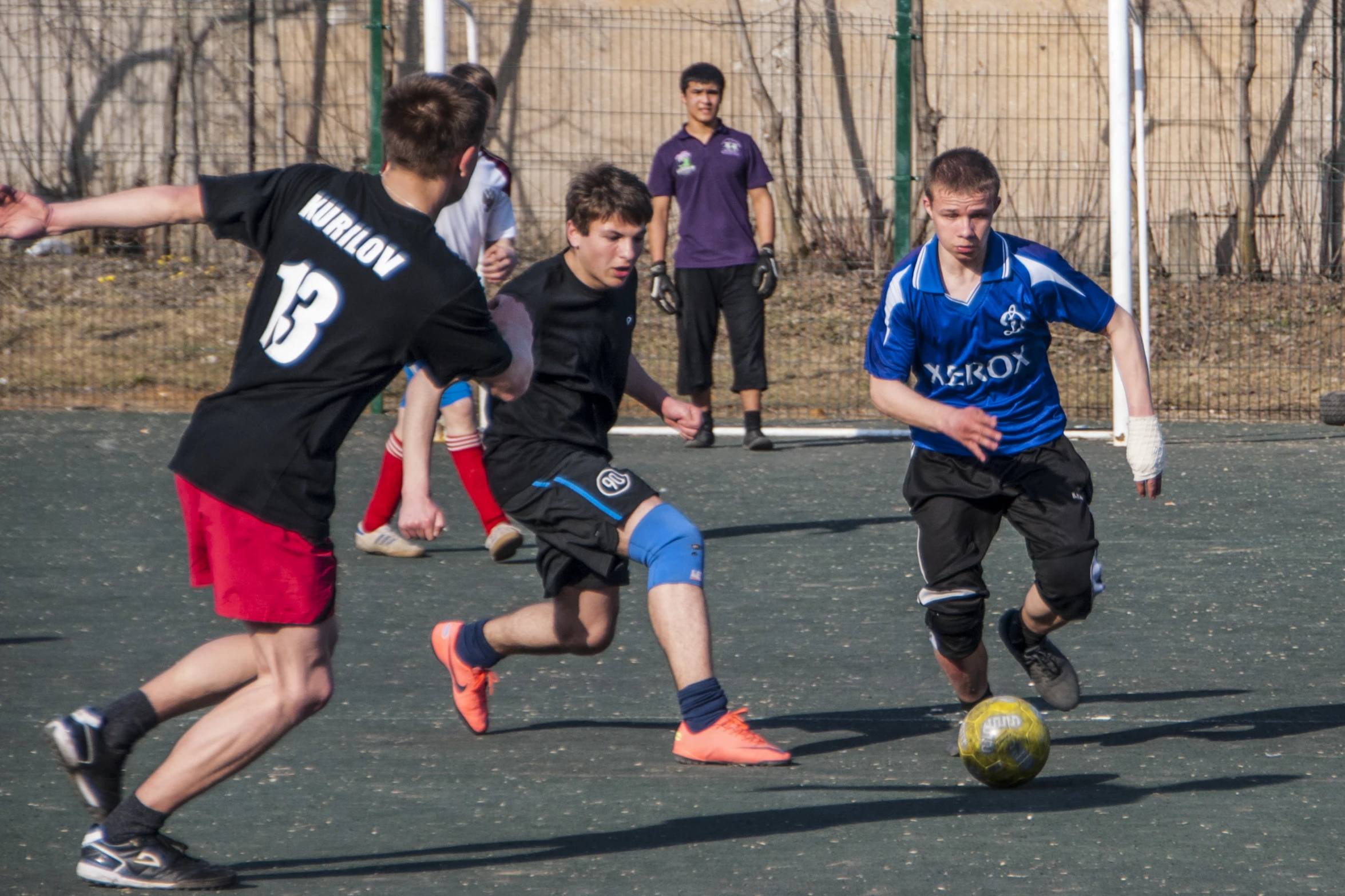 a group of s playing a game of soccer