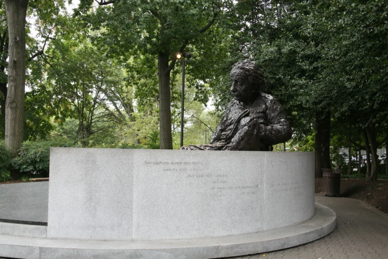 an image of a statue in the middle of the woods