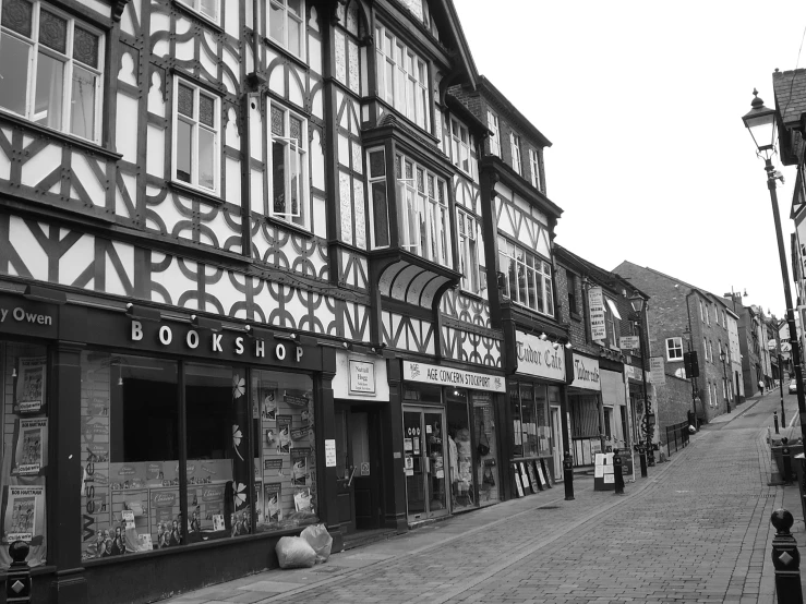 shops on a city street with buildings painted in half