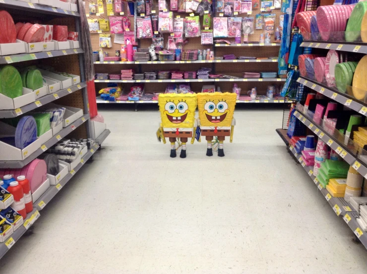 some spongebombs are in the middle of a store aisle