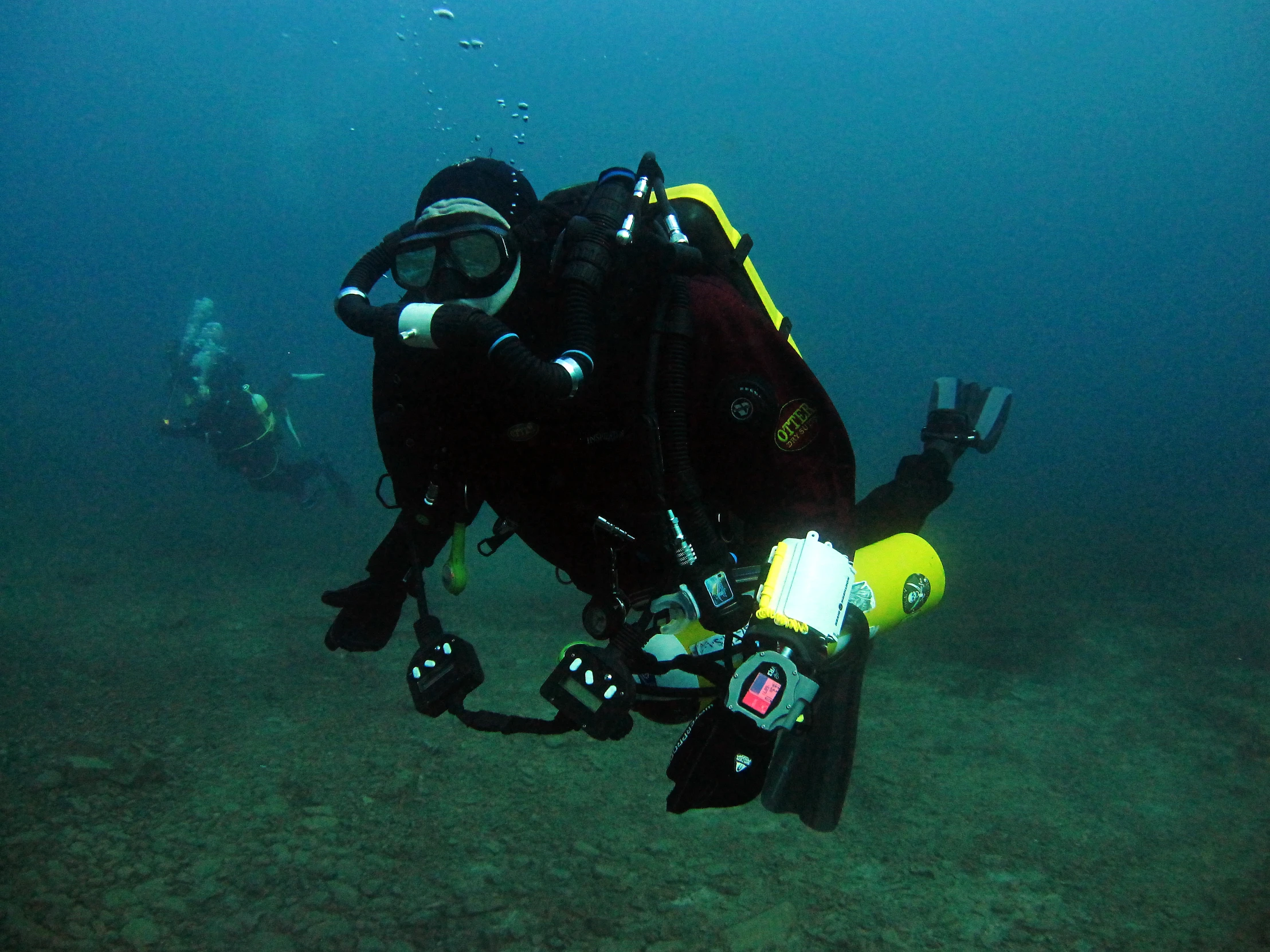 a person is in the water with a scuba suit