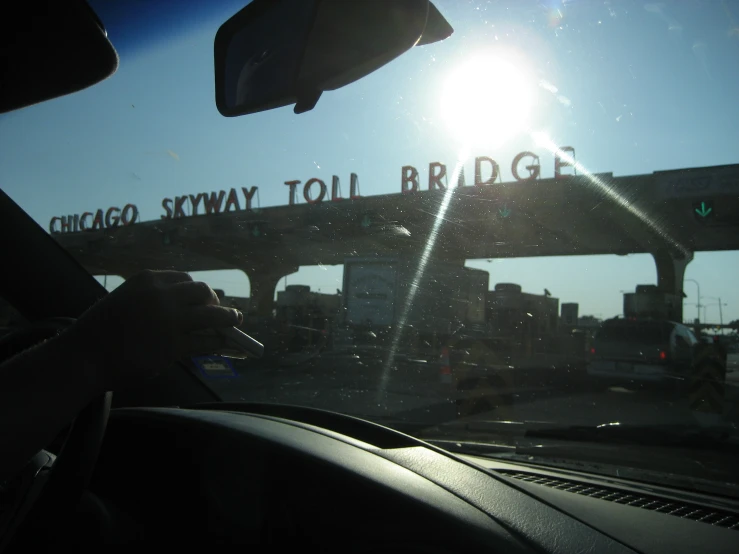 a view from a car shows a bridge with a chicago skyway toll entrance