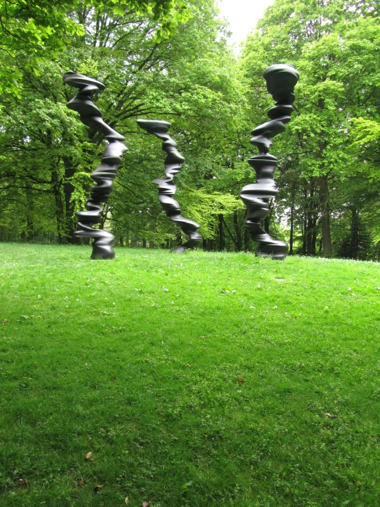 a sculpture on top of a green field
