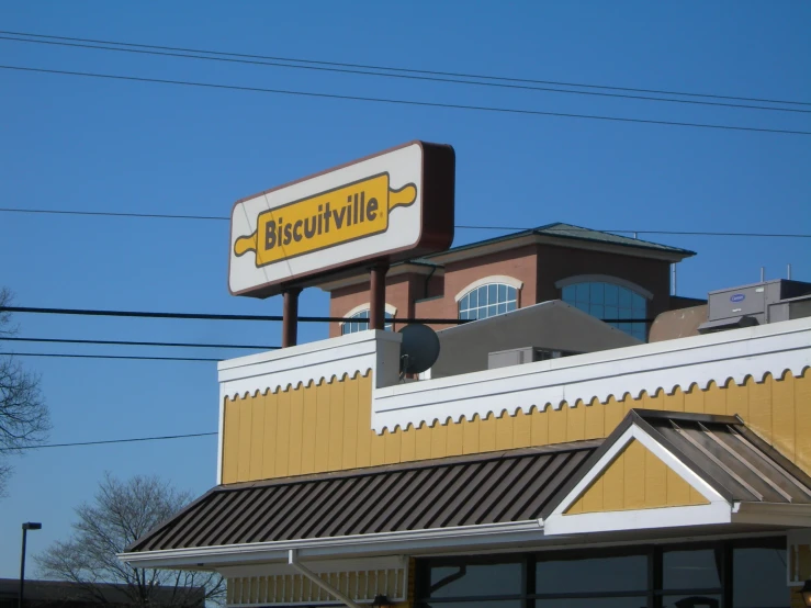 the biscuit willie sign on top of a building