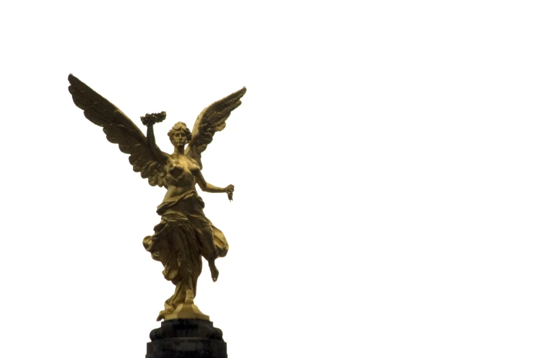 there is a golden angel statue on top of a tower