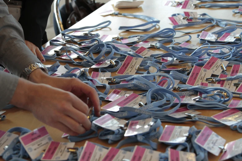 a table full of pairs of scissors and plastic coupons