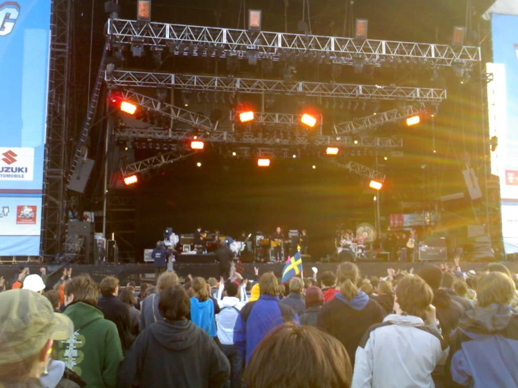 a group of people sitting in front of a concert