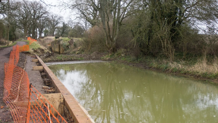 a bridge that is sitting over some water