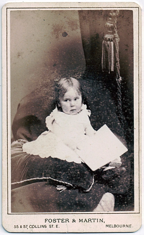 an old fashioned po of a child with a book