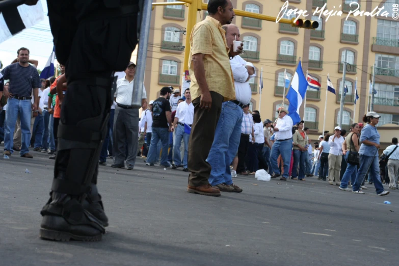 a large group of people walking down a street