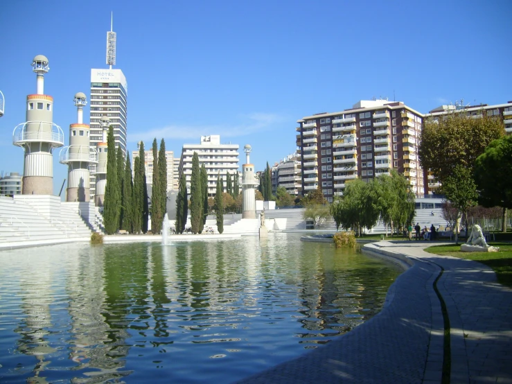 a large pond that is sitting in the middle of a city