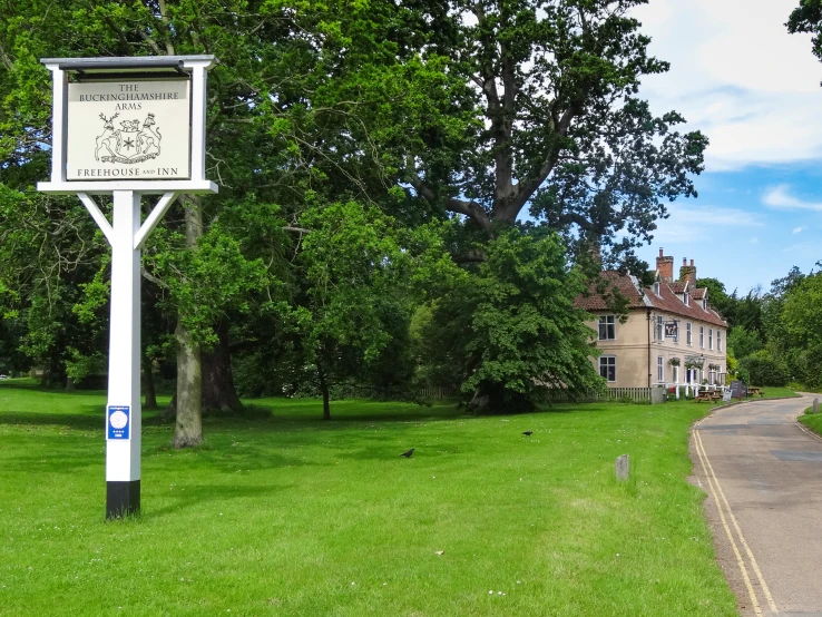 a sign for a residential area next to a road