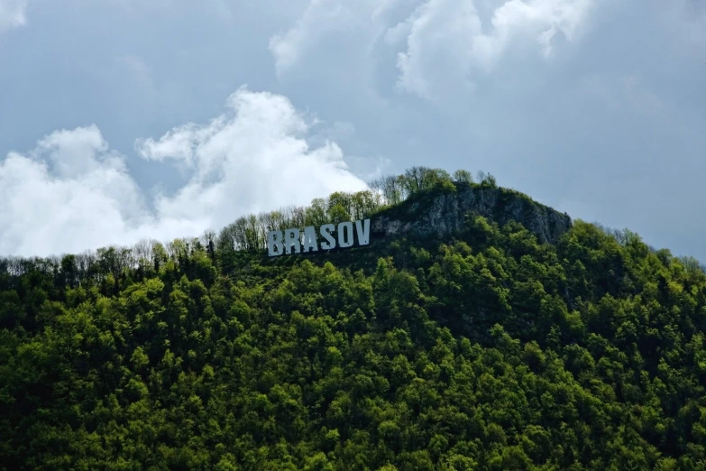 the building on the top of a hill has been vandalized