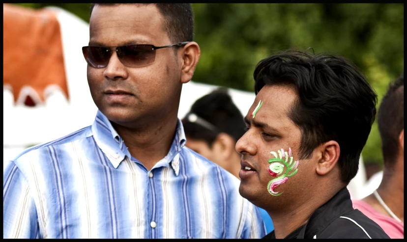 two men who have painted on their faces