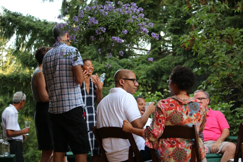 a group of people that are sitting around table