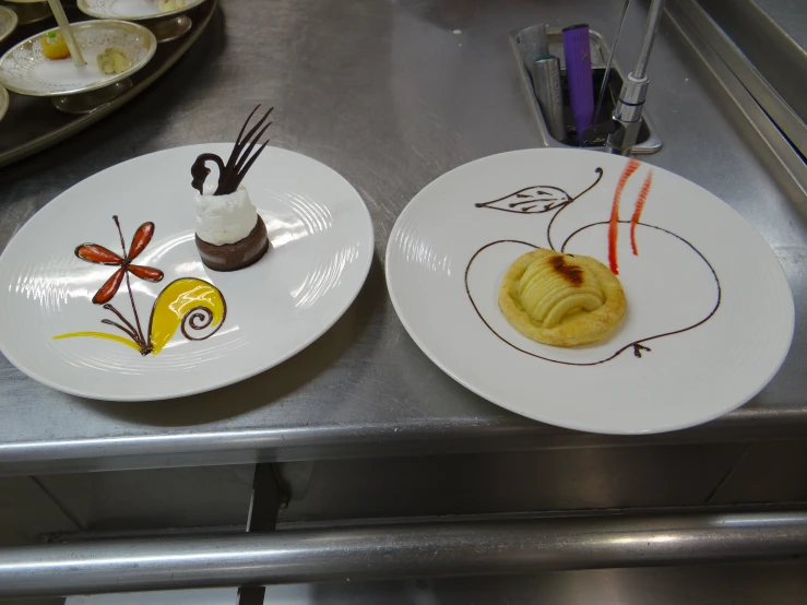 a couple of plates with decorative food items on them