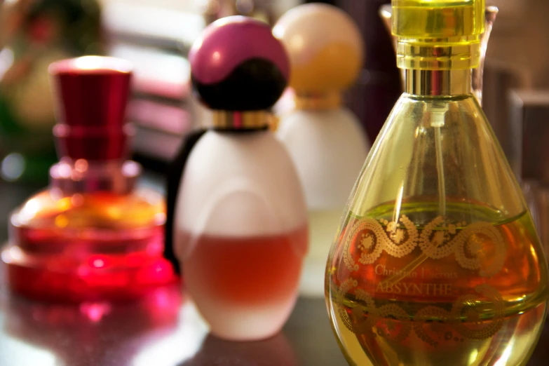 several bottles of perfume sitting on a table