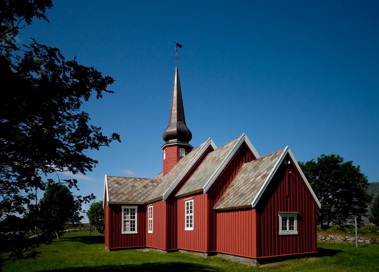an old church with red shingled roof