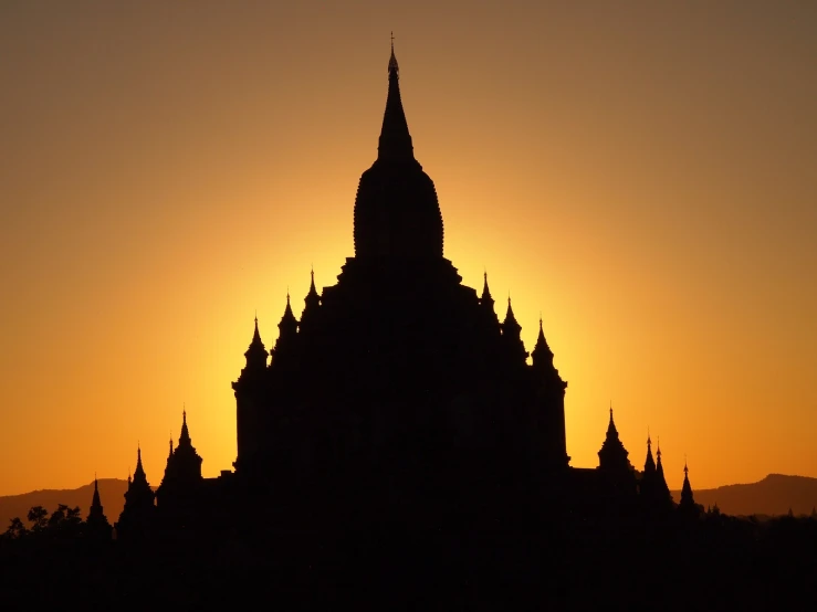 the top of a building with many spires