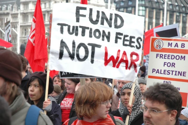 people with banners protesting during a demonstration