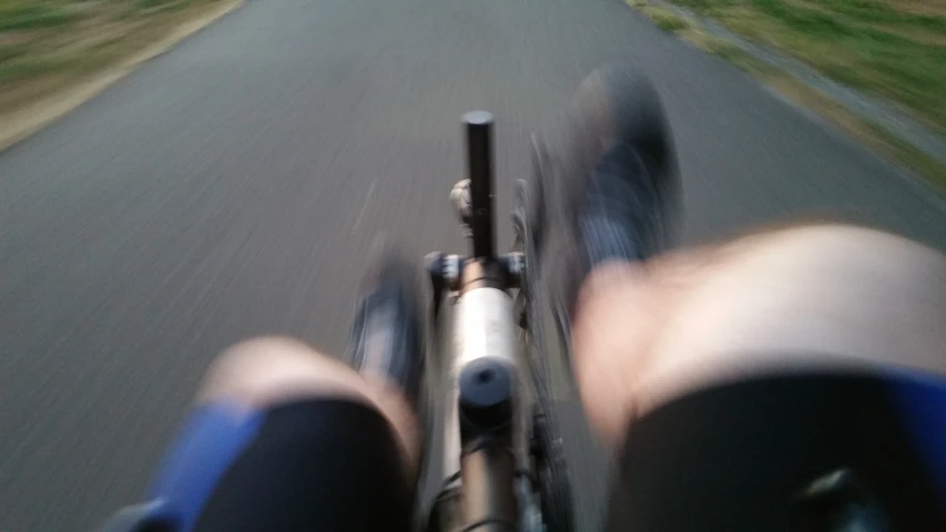a blurry po of a person riding a bike