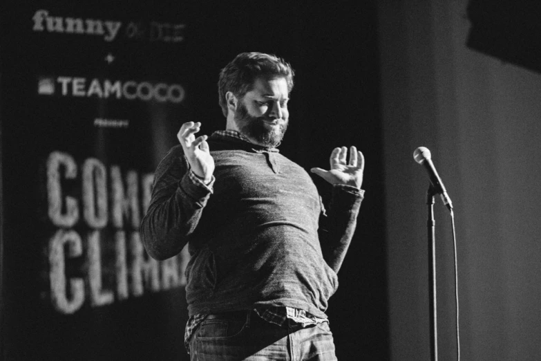 a man giving a speech at an event