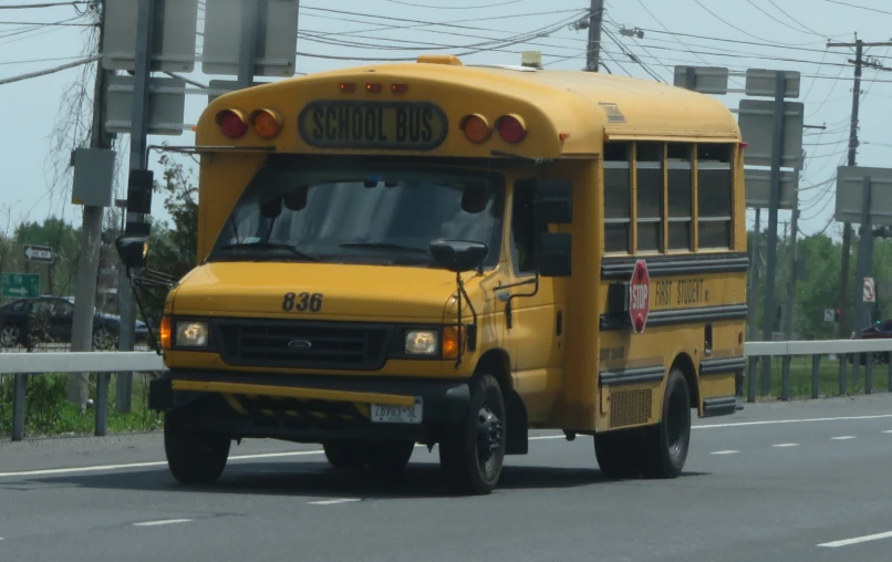 a school bus driving down a street