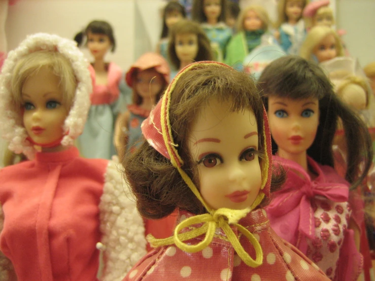 a closeup of several dolls standing in a row