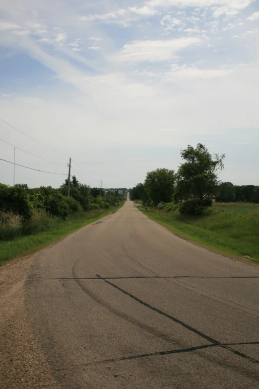 an empty road that looks so small and very nice