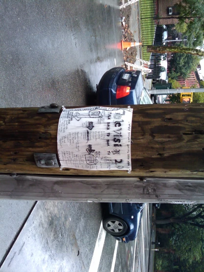 the wood post is propped up on a wooden post