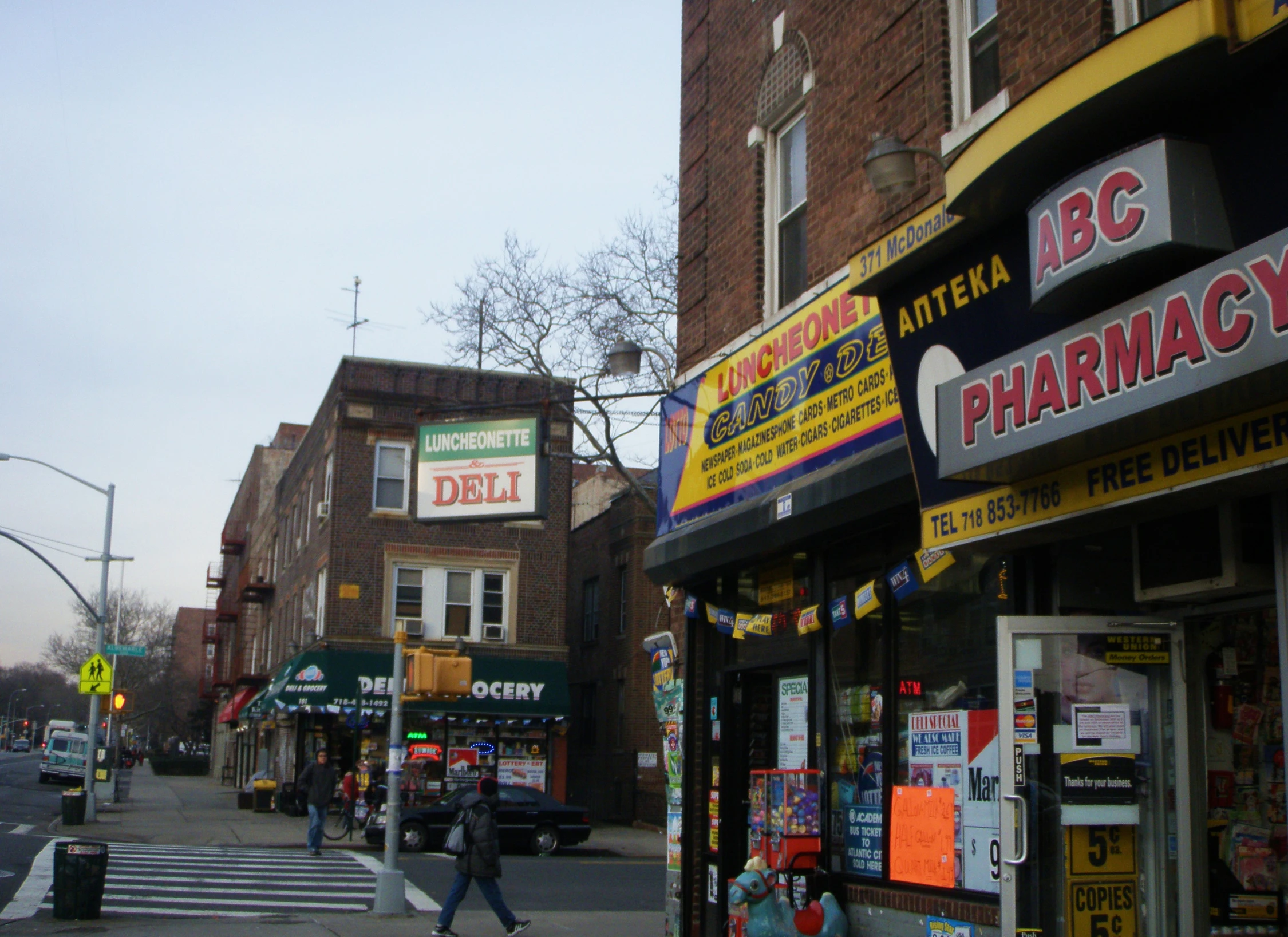 a street with pharmacy stores on the side of it